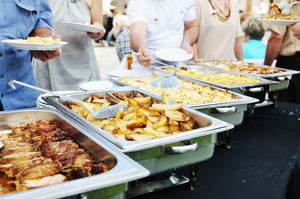 people choosing food from table on catering and buffet party on business seminar conference or wedding